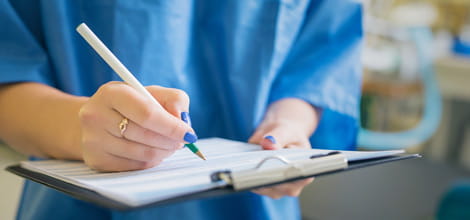 doctor signing a form